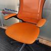 Orange Mesh Operator Chairs with Foldback Arms