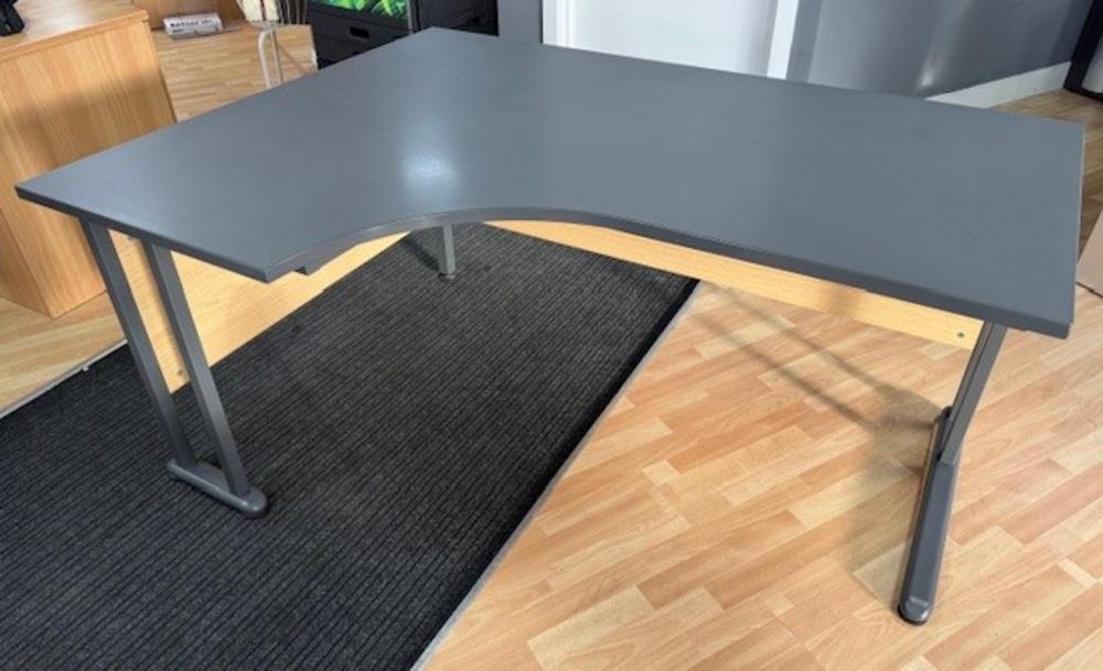1600 x 1200mm Left Hand Radial Desk in Graphite with Stone Oak Modesty Panels 