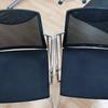 Pair of Matching Stackable Chrome Frame Black Mesh Chairs with Fixed Arms 